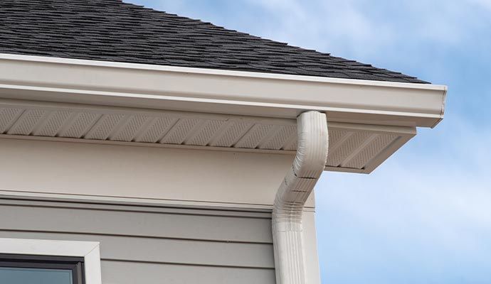 Residential house with new gutter drainage system Installed gutter drainage system for residential house exterior.