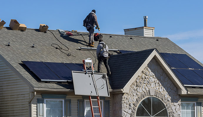 Expert team installing solar-panels